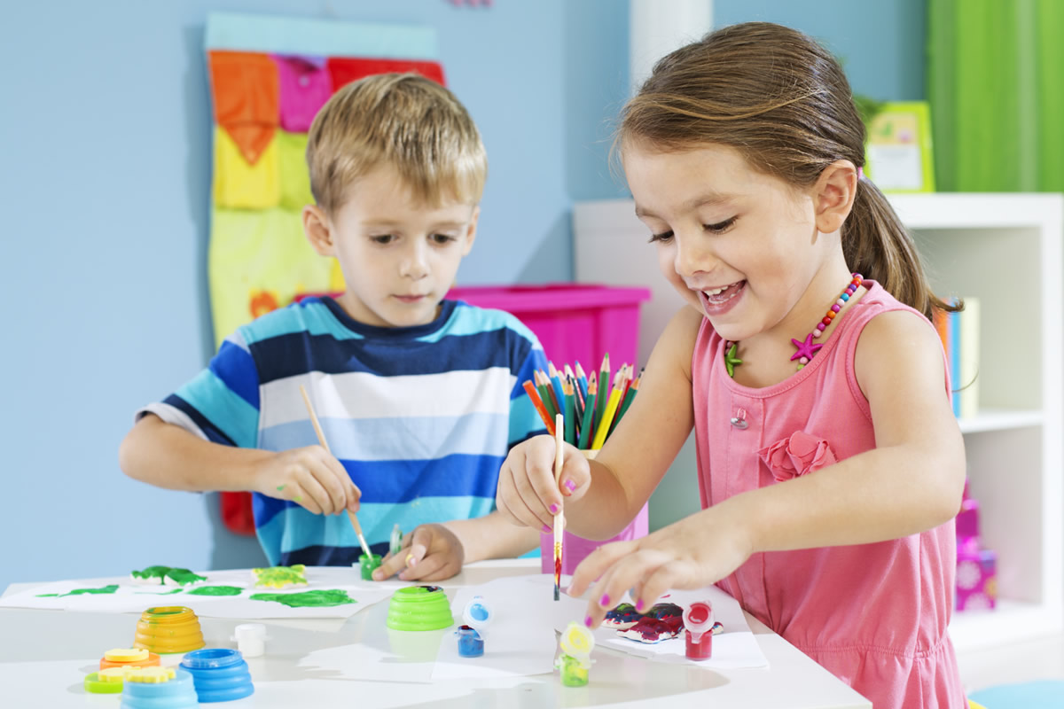 children painting in a Langley daycare